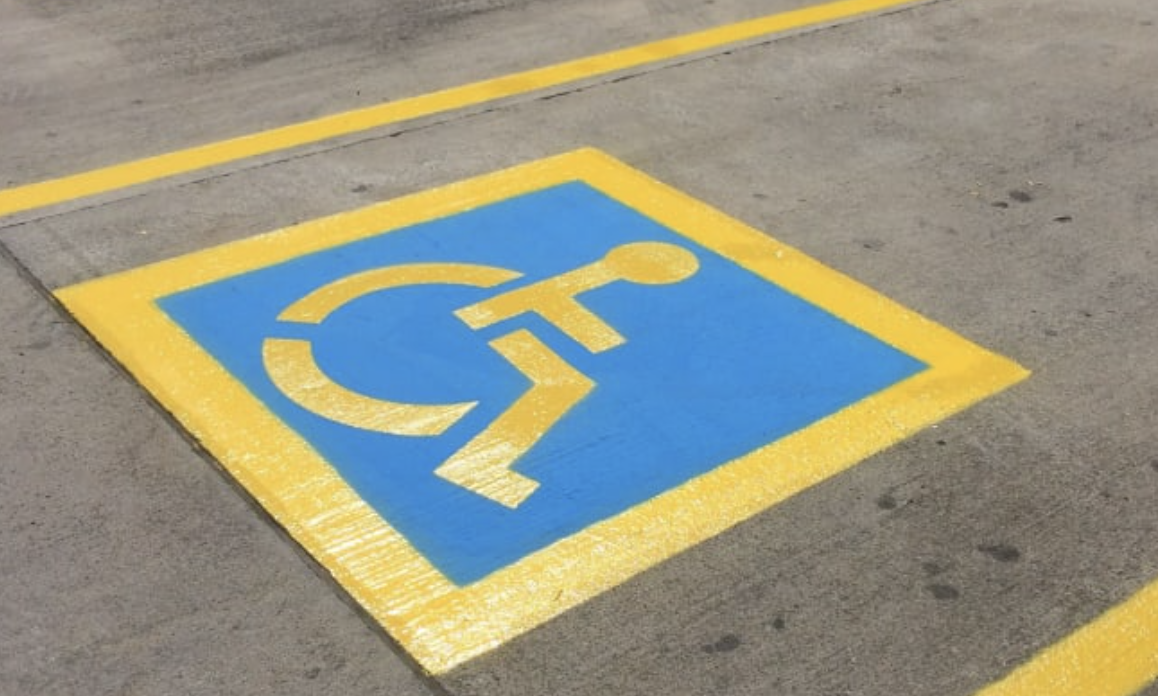ADA compliant accessible parking space with fresh blue paint